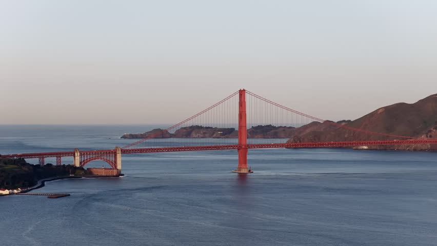 Golden Gate Bridge over Pacific Ocean in San Francisco, California at sunset aerial view. g.