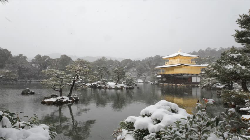 Serene Winter Landscape of Kinkaku-ji Golden Pavilion Temple in Snow with Pond Reflection, Kyoto, Japan