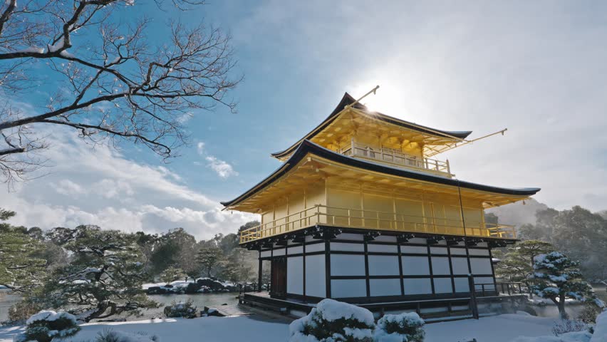 Stunning View of Kinkaku-ji Golden Pavilion Temple in Winter with Snow and Sunlight, Kyoto, Japan