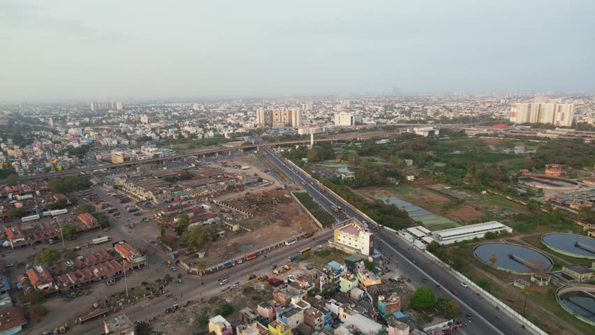 Aerial shot of Koyambedu market and bus stand. Beautiful shot shows you the Market buildings, Sewage treatment plant, Metro Bridge and Main road.