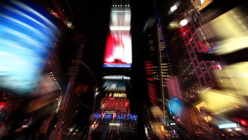 Time Lapse of busy street action on Times Square at night in front of Police