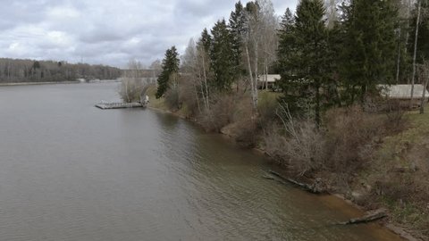 Forward Drone Flight Past Riverside Pier