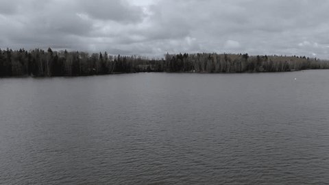 Drone Flying Forward Rising above River