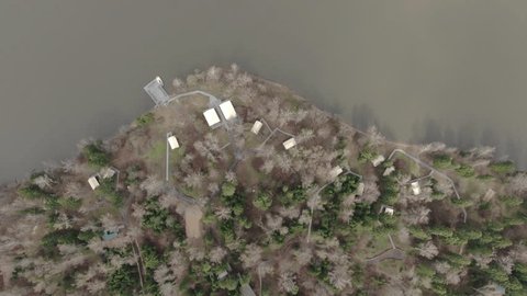 Upward Camera Tilt over Wooded Peninsula