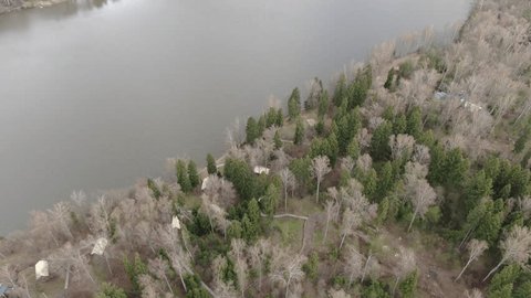 Backward Ascent above Wooded River Bend
