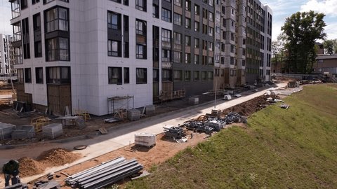 Drone Passing by Unfinished Residential Building