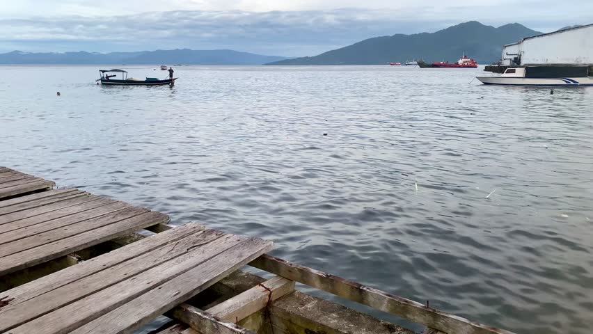 footage of a broken wooden bridge, fragile wooden bridge, wooden bridge on the beach.