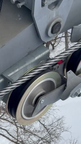 Chamonix ski lift cable moving through the French Alps winter