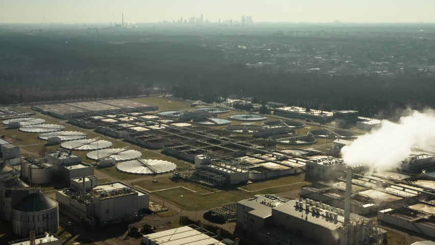 Massive municipal infrastructure processes liquid waste and purifies wastewater to support metropolitan ecology and sanitation for capital city population and environment protection.