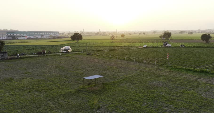 Golden Hour Over Rural Farmland and Industrial Outskirts