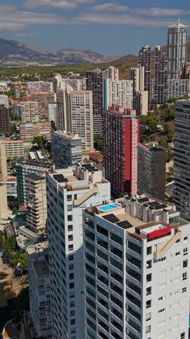 Benidorm modern skyline with dense high rise apartment towers aerial view Spain.