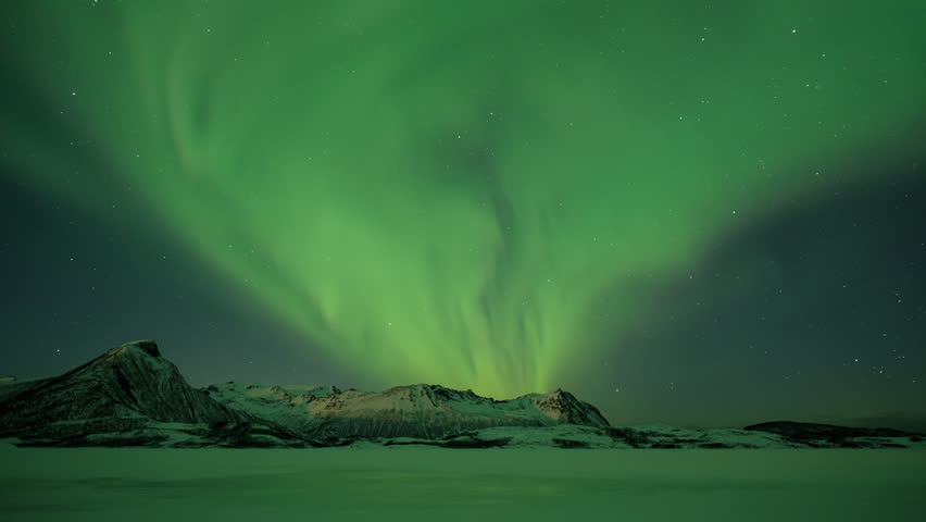 Beautiful Northern Lights moving across Mountains in Northern Norway