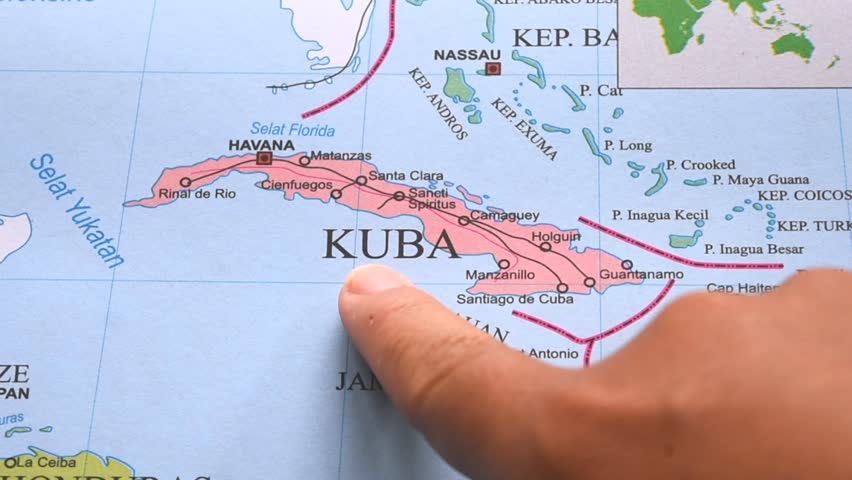 Map of Cuba. Hand pointing to a map of Cuba. Cuba is an island nation located in the Caribbean, on the North American continent.