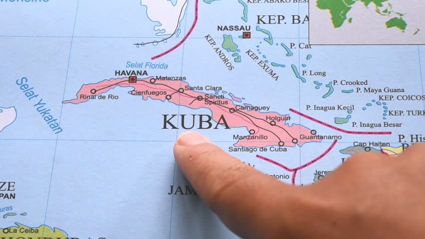 Map of Cuba. Hand pointing to a map of Cuba. Cuba is an island nation located in the Caribbean, on the North American continent.