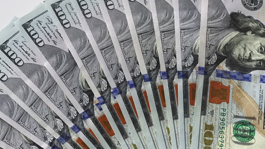 Top view hundred dollar banknotes fan. Detailed Benjamin Franklin portrait. Financial stability business success investment background. US currency banking finance economy cash money professional