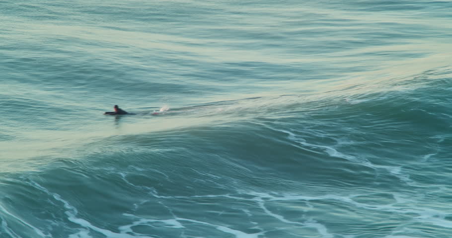 Skilled Surfer Perfectly Glides Over Big Waves In Porthtowan Coast In Cornwall - aerial shot