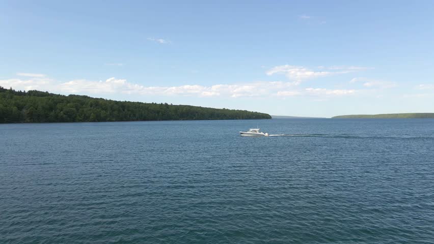 Aerial view of a boat sailing in Lake Superior, Apostole island area, discover and visit wisconsin, travel and explore during the summer