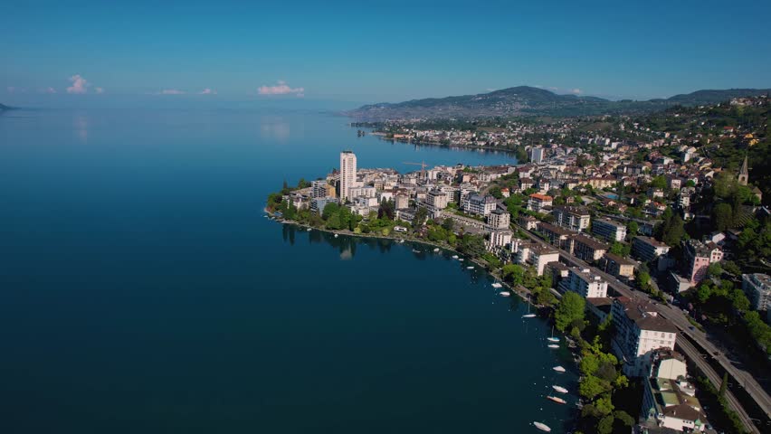 Aerial view around the city Montreux beside lake Geneva in Switzerland on a sunny noon in summer.