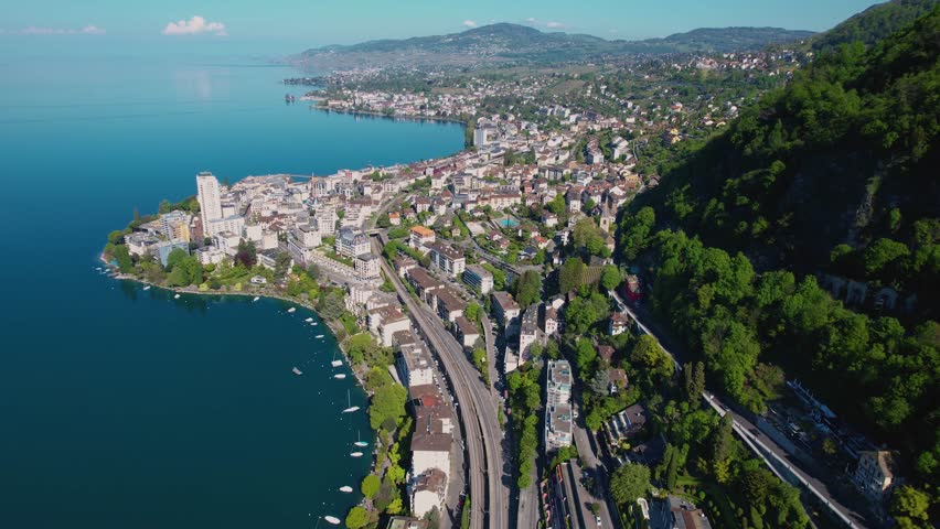 Aerial view around the city Montreux beside lake Geneva in Switzerland on a sunny noon in summer.