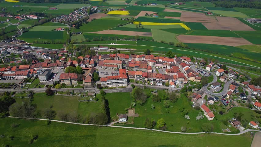 Aerial view around the old town of the city Romont  in Switzerland on a sunny noon in summer.
