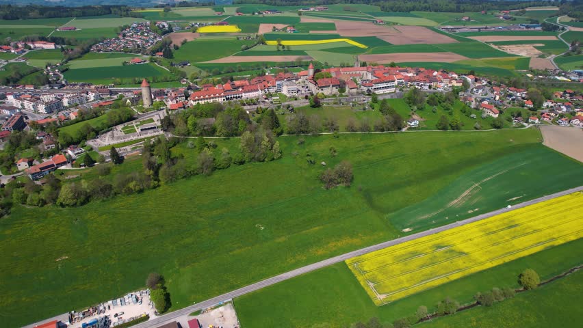 Aerial view around the old town of the city Romont  in Switzerland on a sunny noon in summer.