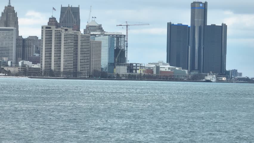Aerial Telezoom View of Detroit and the Detroit River in Michigan