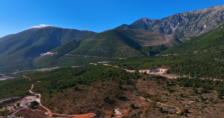 Drone tilting toward the Llogara mountain pass, sunny, summer day in Albania
