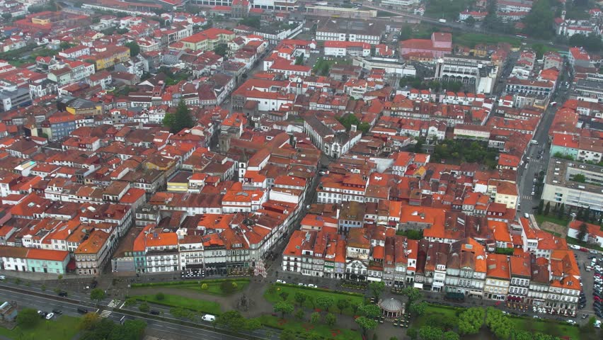 A panoramic aerial view around the old town of the city Viana do Castelo in Portugal on a cloudy spring noon