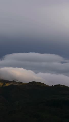 Clouds layer moving over mountain region of Colombia, timelapse vertical video