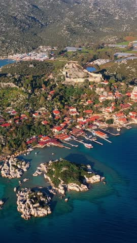 Aerial view of the picturesque secluded village of Kaleköy (Simena) on the Lycian coast of Turkey (Antalya region), famous for its partially submerged ancient ruins.