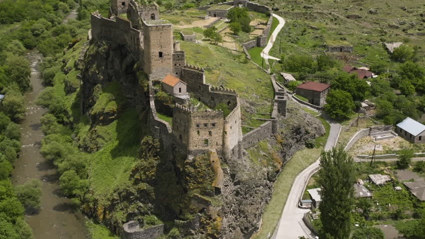 Ancient Castle Towering In The Rocky Mountains At Khertvisi Village Of Aspindza Municipality, Southern Georgia. Aerial Drone Shot