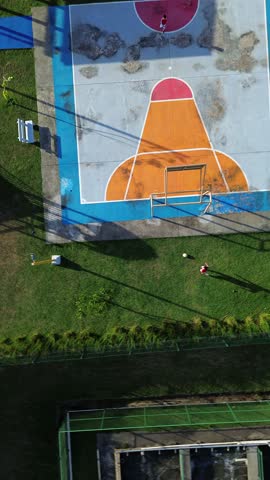 A basketball court with a red and orange net