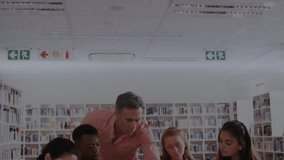 Student tapping laptop and causing holograms, teacher helping, students seeing charts in education. Library, collaboration, instructor, tablet, bookshelves, augmented, reality - Powered by Shutterstock - Get 15% off with code: PIKWIZARD15