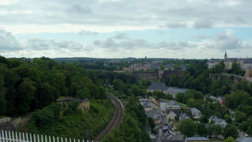 Street view around the city and capitol Luxembourg in the country Luxembourg driving  around the streets from top of a bus on a cloudy day in spring