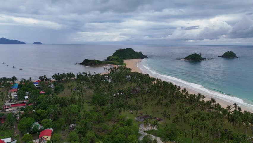 Aerial drone view of Nacpan Beach and its glamping on Palawan Island in the Philippines