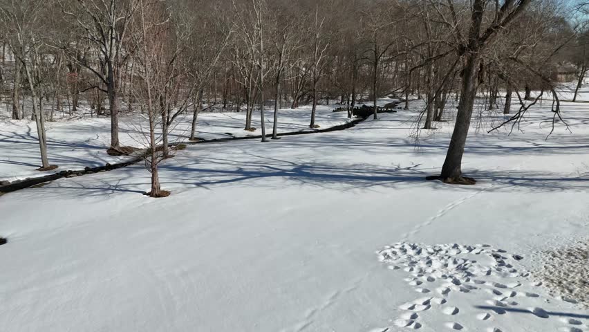 4K Aerial View of Snowy Fulton Park and Frozen Pond in Waterbury, Connecticut

