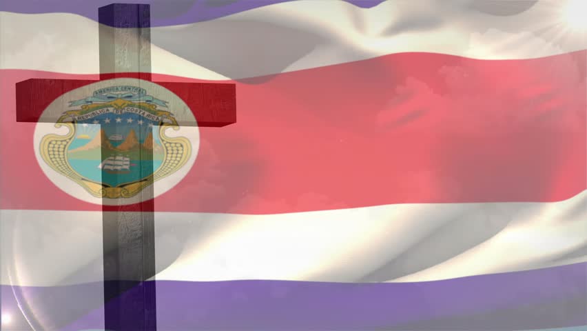 Wind starting, striped flag billowing and folding across frame, emblem shifting under post overlay. Ensign, tricolor, crest, pole, outdoor, sky, lensflare