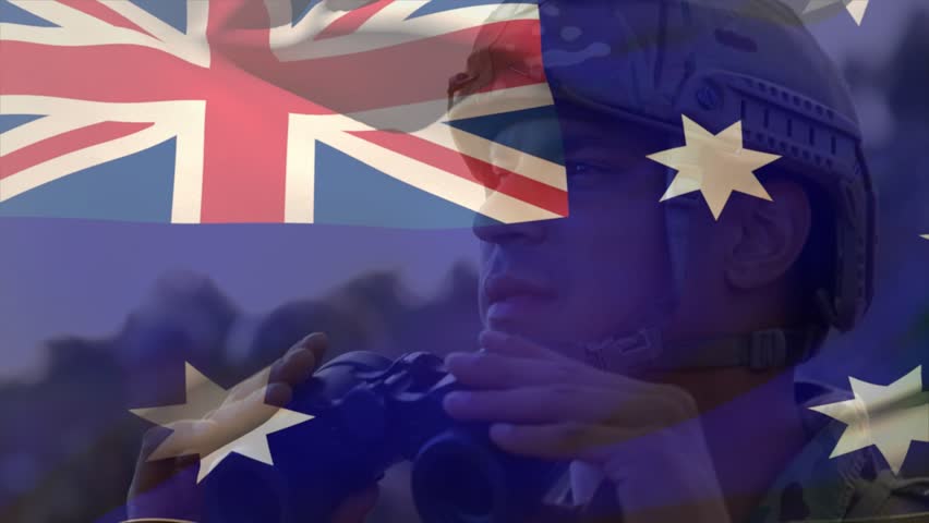 Soldier raising binoculars and scanning for military reconnaissance, flag overlay across frame. Camouflage, helmet, field, horizon, lookout, optics, dusk