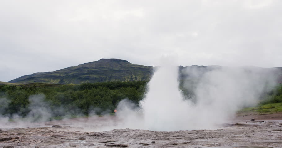 Geysir geyser ejecting water and steam, Golden Circle Iceland