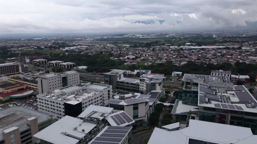 Aerial shot flying over a shopping mall in the city of San Jose, Costa Rica