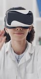 Woman, scientist and vr with headset in laboratory for futuristic interaction or development. Female person, virtual reality or medical simulation with UI for clinical trial, research or innovation - Powered by Shutterstock - Get 15% off with code: PIKWIZARD15