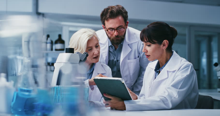 Research, science and people in workplace, tablet for test results and discussion for medical cure. Scientist, man or women in lab, tech or cooperation for digital solution, clinical trial or talking