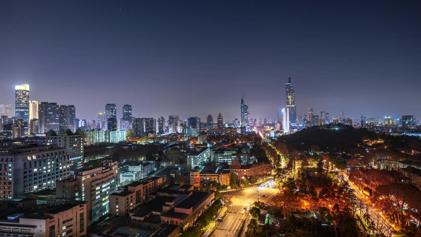 Nanjing, China — Zifeng Tower and the city’s flowing traffic light trails at night