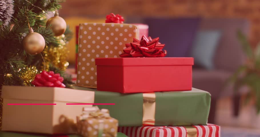Animation of happy holidays text over christmas presents. christmas, celebration and digital interface concept digitally generated video.