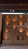Warmly lit carved stone panels with cultural motifs decorate a luxury resort lobby in Palau - Powered by Shutterstock - Get 15% off with code: PIKWIZARD15