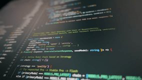 Lines of artificial intelligence code scroll smoothly on a modern computer monitor screen. Concept of vibe coding and using automated tools for rapid software development. - Powered by Shutterstock - Get 15% off with code: PIKWIZARD15