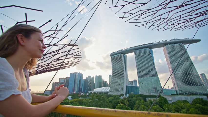 Tourist walking looking at Marina Bay Sands in Singapore. Travel and tourism modern architecture of Asia.