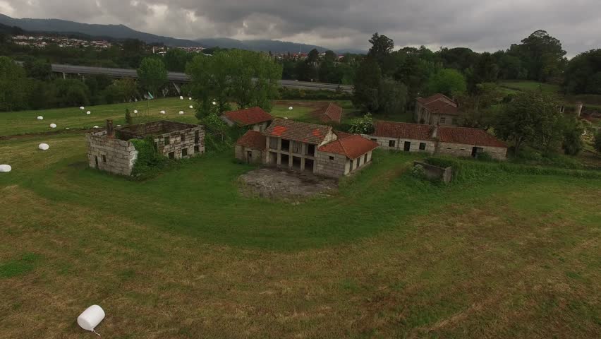 Farm field with hay bales