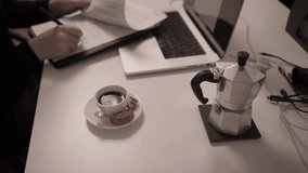 Closed Notebook on Work Desk Beside Laptop and Coffee Cup
Closed notebook placed on desk next to laptop and coffee cup. Home office setup and modern remote work lifestyle concept. - Powered by Shutterstock - Get 15% off with code: PIKWIZARD15