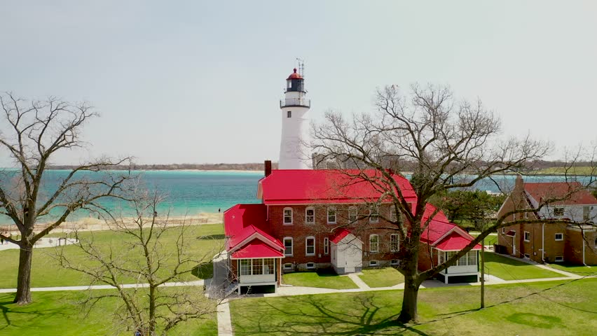 Fort Gratiot Lighthouse in Port Huron, Michigan with drone video moving up.